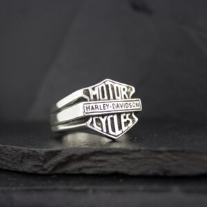 A sleek silver ring with 'AMOR' and 'KYLES' engraved on it.