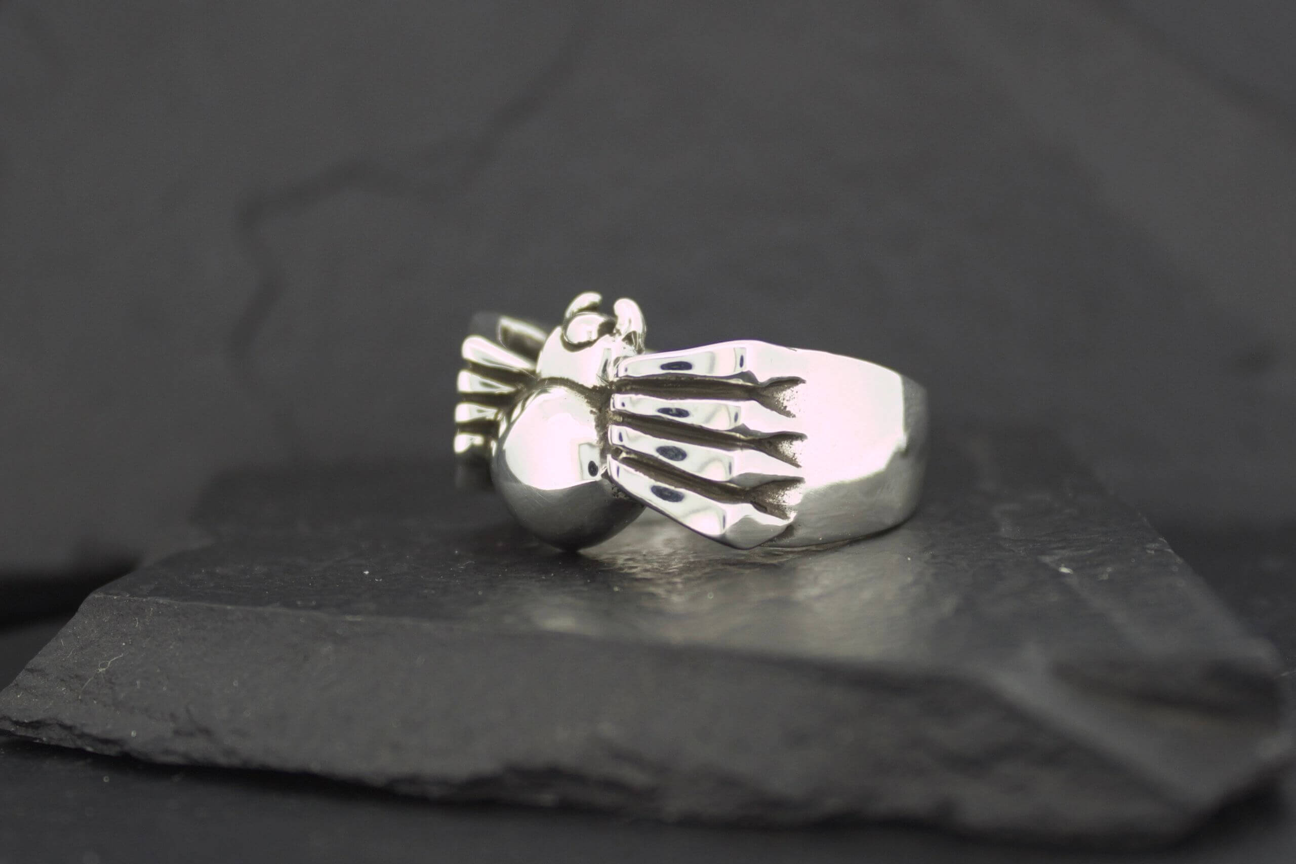 Silver ring with a spider design.