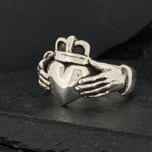 Silver Claddagh ring featuring hands, heart, and crown design.