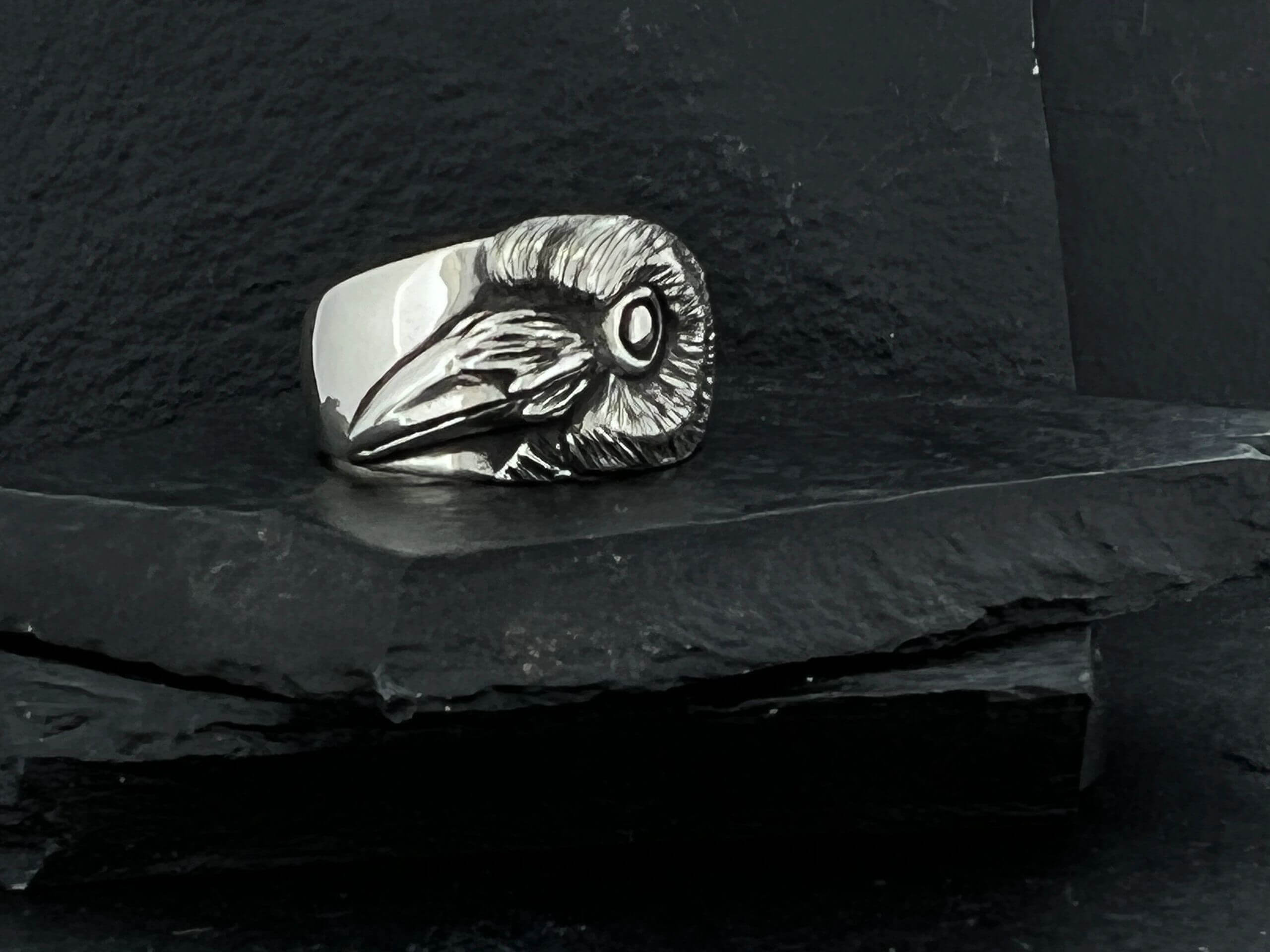 Silver ring featuring a detailed ram skull design.