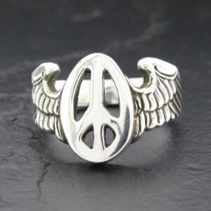 Silver ring with peace symbol and wing designs.