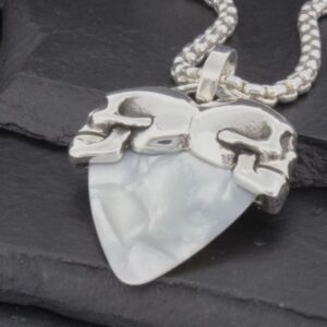 Silver chain necklace with a white, uniquely shaped pendant.