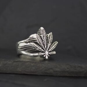 Silver ring shaped like a cannabis leaf.