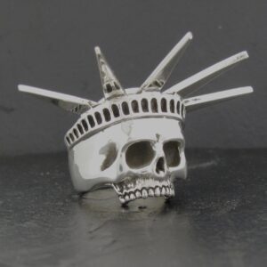 A skull ring designed like the Statue of Liberty's crown.