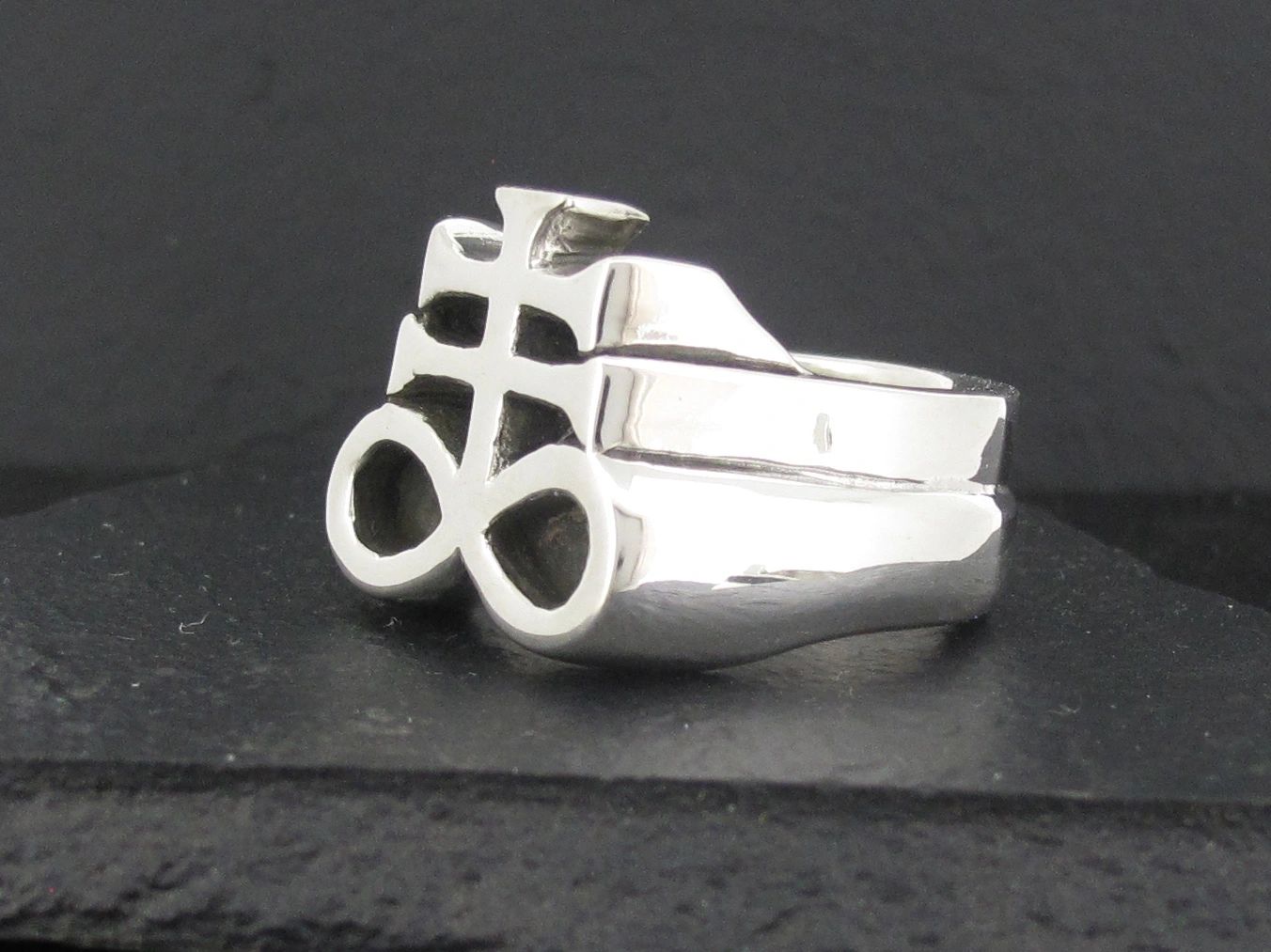 Silver ring with an abstract geometric design.
