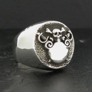 Silver ring with an intricate skull and tentacle design.
