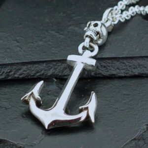 Shiny silver anchor pendant on a textured chain.
