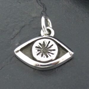 Silver eye-shaped pendant with a starburst design in the center.
