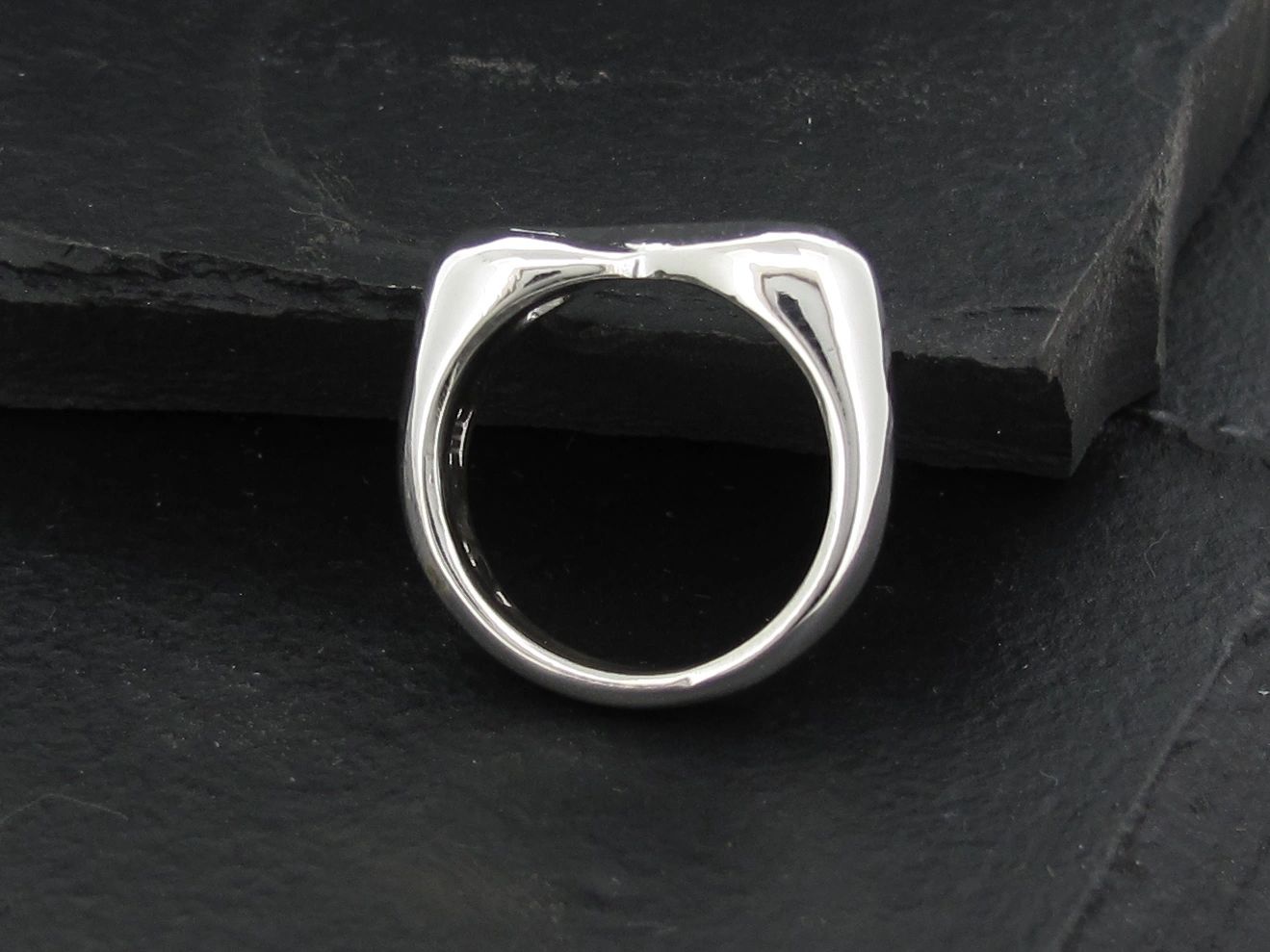 Sleek silver ring with a modern, minimalist design.