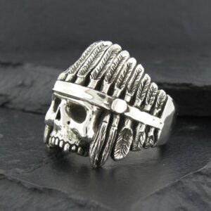 Silver skull ring with Native American headdress design.