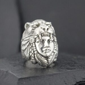 Silver ring featuring a Native American chief wearing a bear headdress.