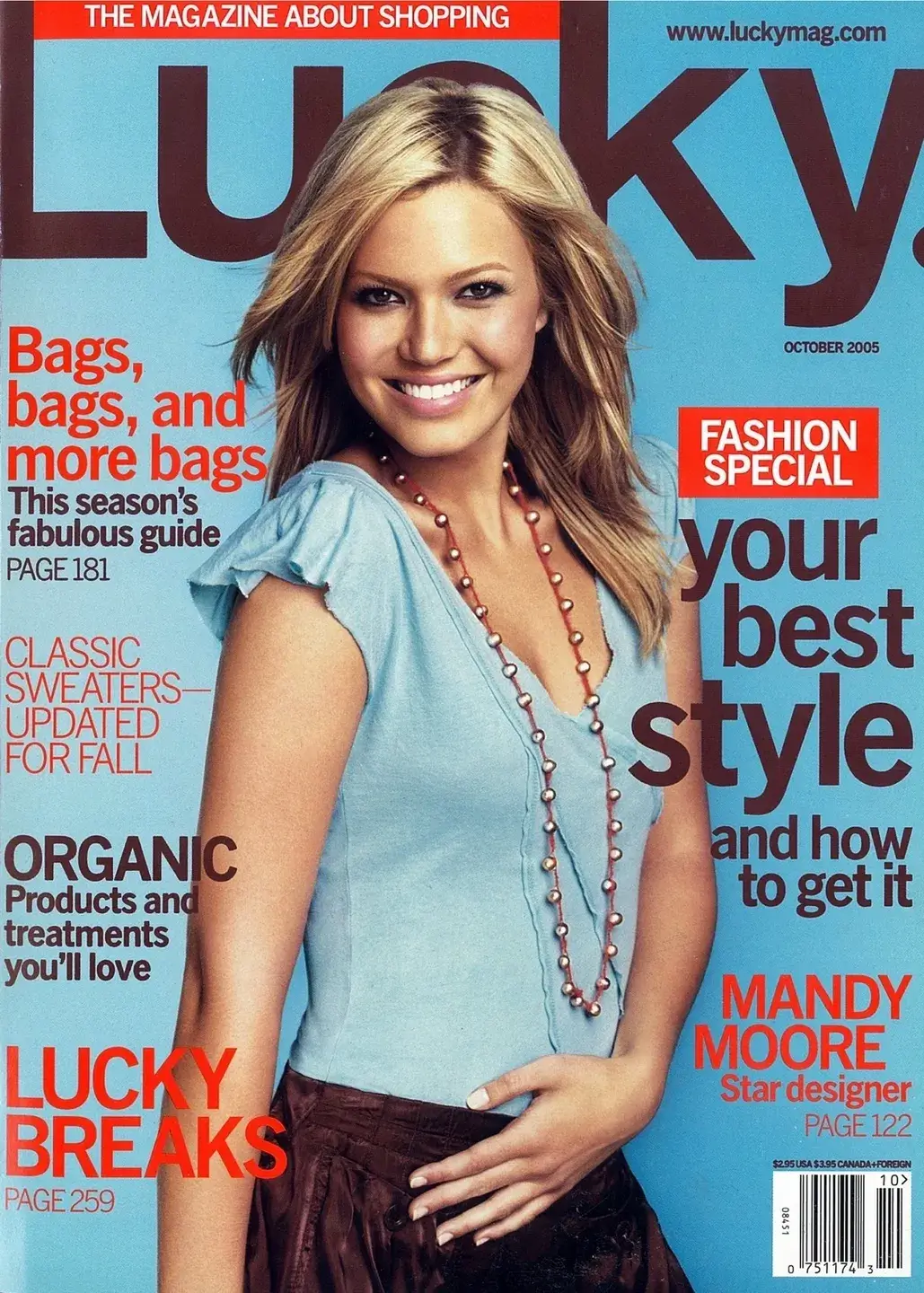 Magazine cover featuring a smiling woman in a turquoise dress.