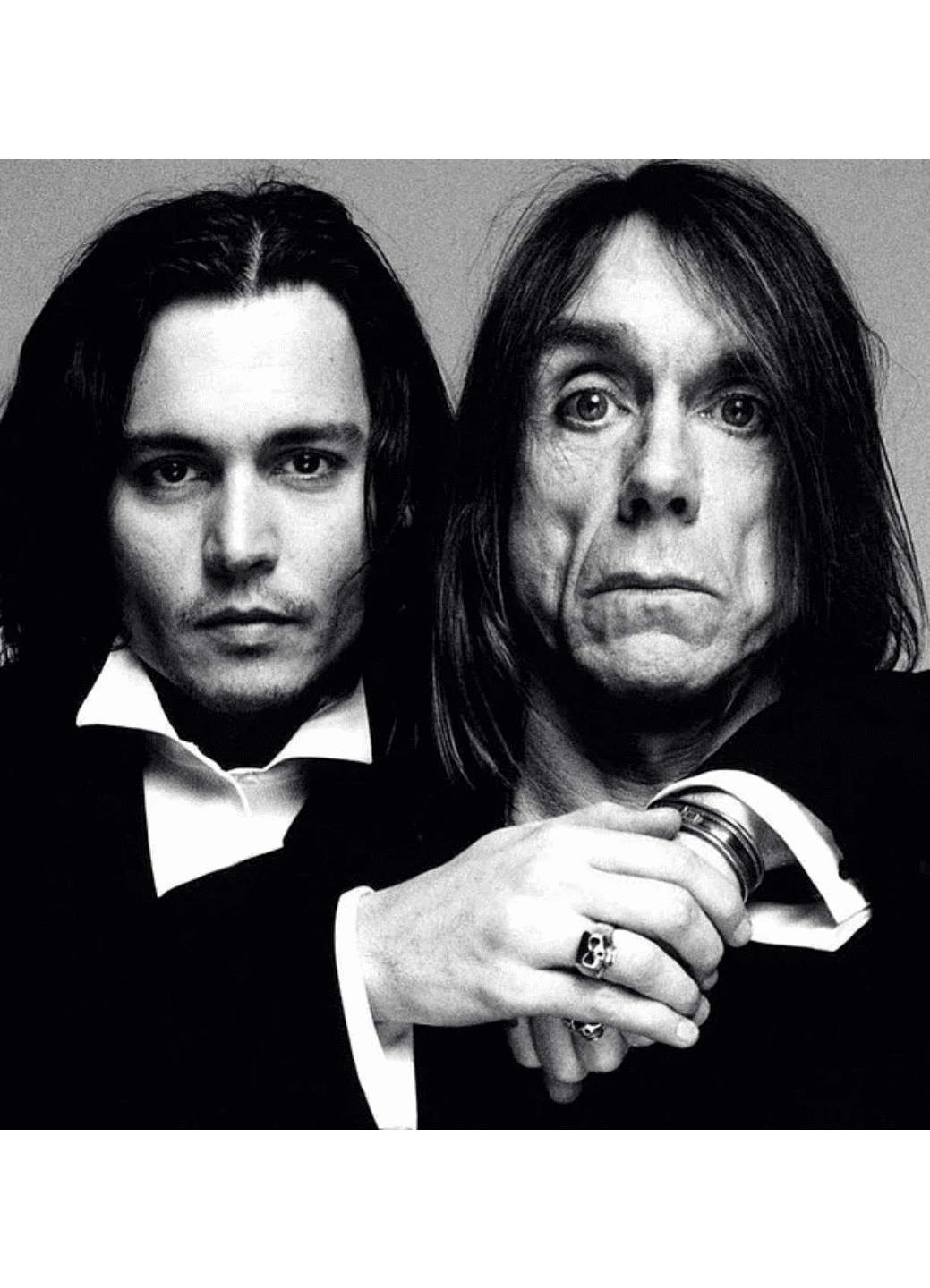Black and white portrait of two iconic rock musicians.